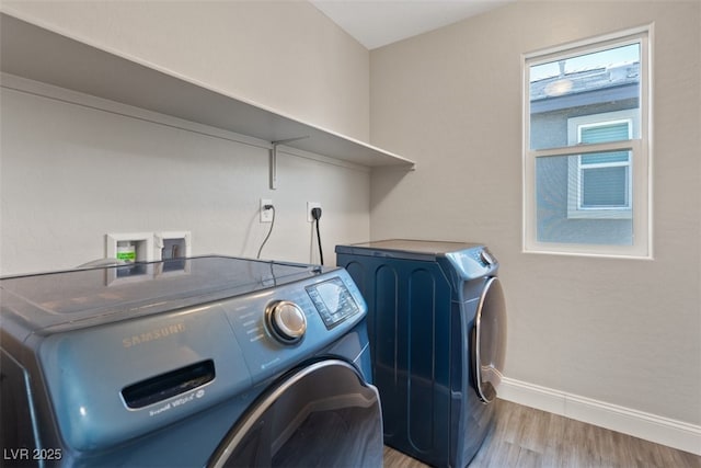10058 Matter Overlook Dr, Las Vegas, NV 89178 - laundry room with washer and clothes dryer and light wood-style floors