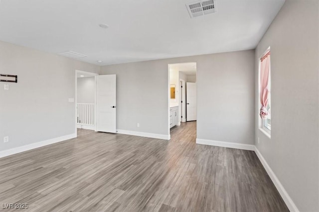 10058 Matter Overlook Dr, Las Vegas, NV 89178 - empty room with wood finished floors and healthy amount of natural light