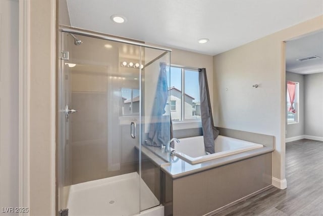 10058 Matter Overlook Dr, Las Vegas, NV 89178 - bathroom featuring a shower stall, a bath, plenty of natural light, and recessed lighting