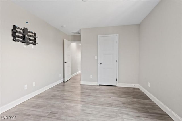 10058 Matter Overlook Dr, Las Vegas, NV 89178 - unfurnished bedroom with baseboards and wood finished floors