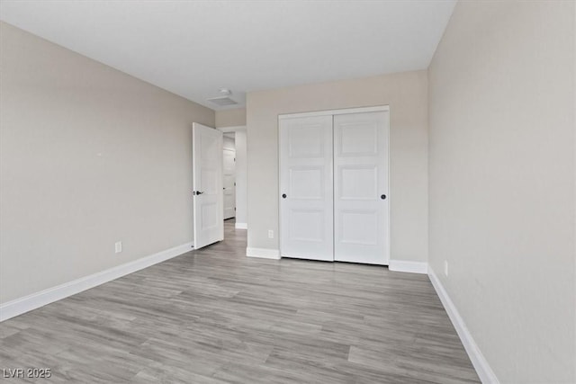 10058 Matter Overlook Dr, Las Vegas, NV 89178 - unfurnished bedroom with wood finished floors and a closet