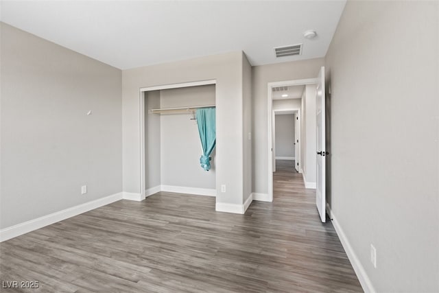 10058 Matter Overlook Dr, Las Vegas, NV 89178 - unfurnished bedroom featuring wood finished floors and a closet