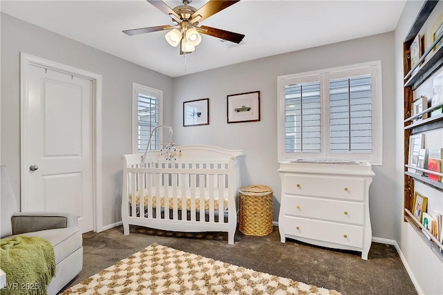 1113 Fragrant Cactus Ct, North Las Vegas, NV 89031 - carpeted bedroom featuring a nursery area and a ceiling fan