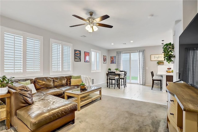 1113 Fragrant Cactus Ct, North Las Vegas, NV 89031 - living room featuring a ceiling fan, plenty of natural light, light tile patterned flooring, recessed lighting, and light colored carpet
