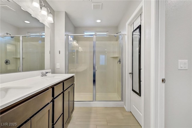 1113 Fragrant Cactus Ct, North Las Vegas, NV 89031 - full bath with a stall shower, double vanity, and recessed lighting