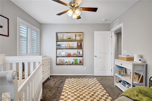 1113 Fragrant Cactus Ct, North Las Vegas, NV 89031 - bedroom featuring dark carpet, a nursery area, and a ceiling fan