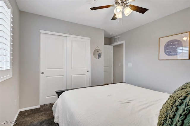 1113 Fragrant Cactus Ct, North Las Vegas, NV 89031 - bedroom with dark carpet, a closet, and a ceiling fan