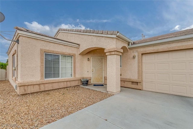 4713 Guma Way N, Las Vegas, NV 89031 - view of front of property featuring driveway, stucco siding, and a garage