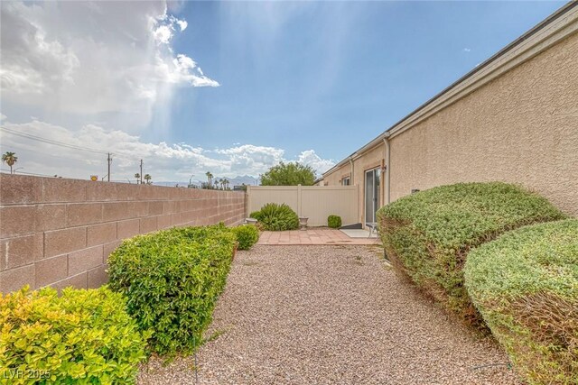 4713 Guma Way N, Las Vegas, NV 89031 - view of yard with a patio
