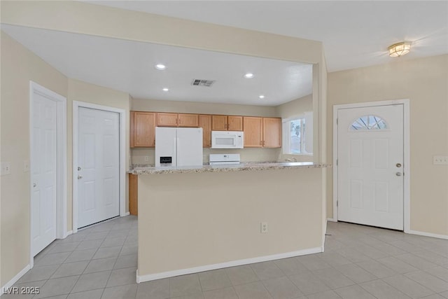 4713 Guma Way N, Las Vegas, NV 89031 - kitchen featuring white appliances, recessed lighting, light tile patterned flooring, a kitchen island, and light stone counters