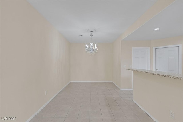 4713 Guma Way N, Las Vegas, NV 89031 - spare room with a chandelier, light tile patterned floors, and recessed lighting