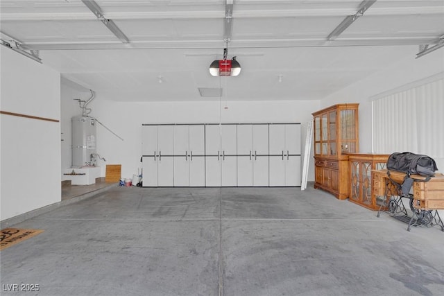 4713 Guma Way N, Las Vegas, NV 89031 - garage with strapped water heater and a garage door opener