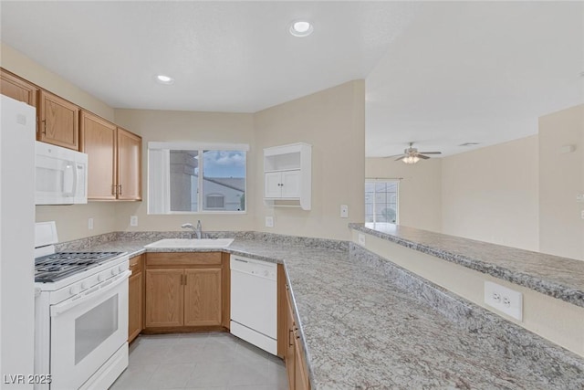 4713 Guma Way N, Las Vegas, NV 89031 - kitchen with white appliances, ceiling fan, light tile patterned floors, recessed lighting, and light stone countertops