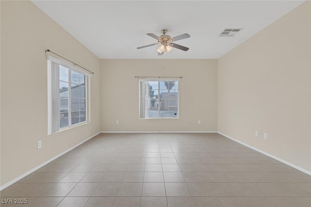 4713 Guma Way N, Las Vegas, NV 89031 - empty room with healthy amount of natural light, ceiling fan, and light tile patterned flooring