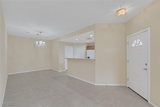 4713 Guma Way N, Las Vegas, NV 89031 - entrance foyer featuring a chandelier, light tile patterned flooring, and recessed lighting
