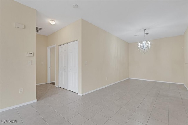 4713 Guma Way N, Las Vegas, NV 89031 - empty room with a chandelier and light tile patterned floors