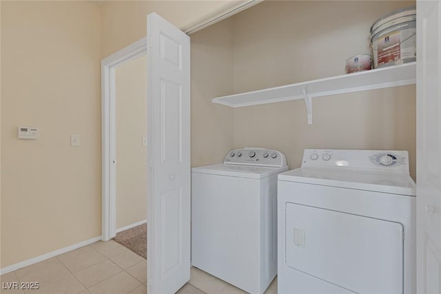 4713 Guma Way N, Las Vegas, NV 89031 - laundry room with washing machine and clothes dryer and light tile patterned floors