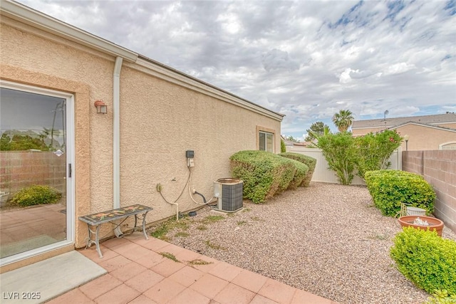 4713 Guma Way N, Las Vegas, NV 89031 - view of property exterior featuring a patio, a fenced backyard, and stucco siding