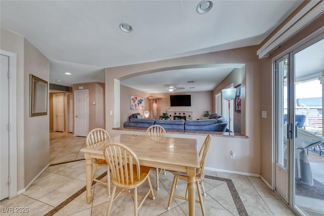8914 Termoli St, Las Vegas, NV 89123 - dining space featuring inlaid floor details, light tile patterned flooring, ceiling fan, recessed lighting, and arched walkways