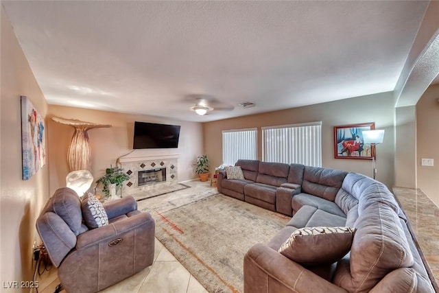 8914 Termoli St, Las Vegas, NV 89123 - living area with a tile fireplace and light tile patterned floors