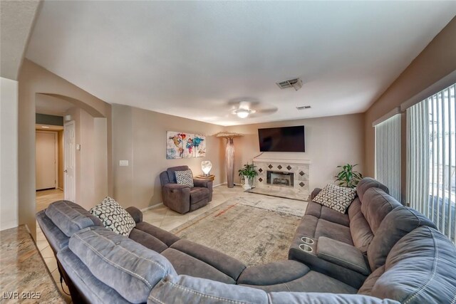 8914 Termoli St, Las Vegas, NV 89123 - living room with arched walkways and a fireplace