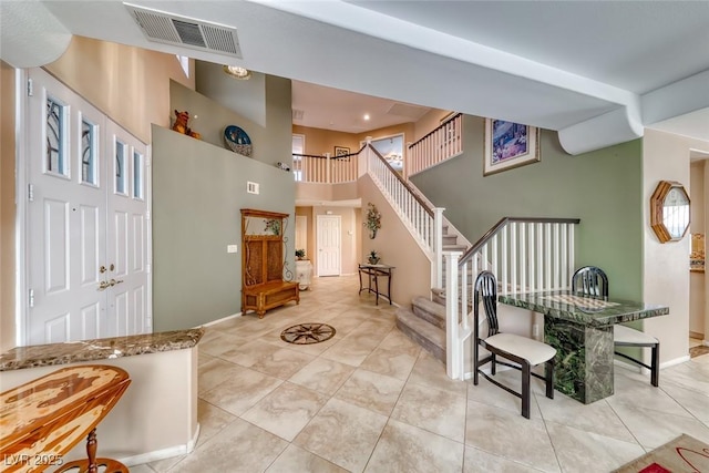 8914 Termoli St, Las Vegas, NV 89123 - entrance foyer featuring a towering ceiling, stairs, and light tile patterned flooring