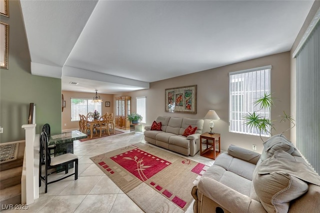 8914 Termoli St, Las Vegas, NV 89123 - living room featuring light tile patterned flooring and a chandelier