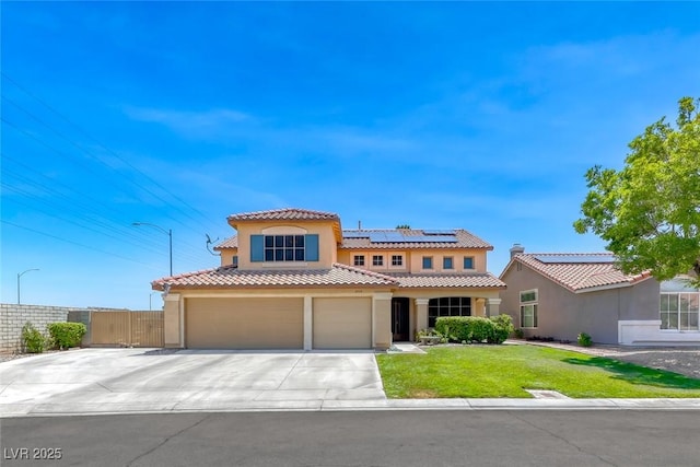 8914 Termoli St, Las Vegas, NV 89123 - mediterranean / spanish house with roof mounted solar panels, a tile roof, a garage, stucco siding, and concrete driveway