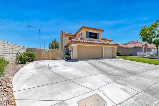 8914 Termoli St, Las Vegas, NV 89123 - mediterranean / spanish-style home featuring driveway, stucco siding, a tile roof, a garage, and a gate