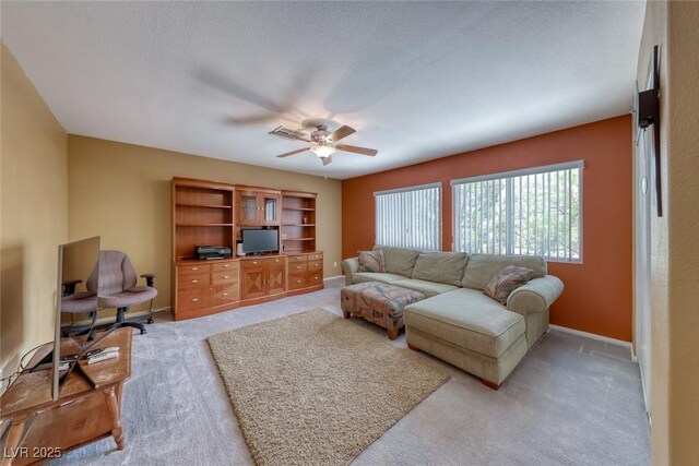 8914 Termoli St, Las Vegas, NV 89123 - living area with light carpet and ceiling fan