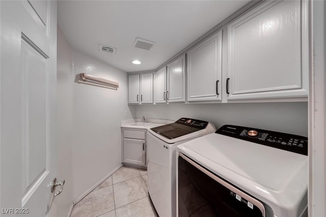 8914 Termoli St, Las Vegas, NV 89123 - washroom featuring cabinet space, washing machine and clothes dryer, light tile patterned floors, and recessed lighting