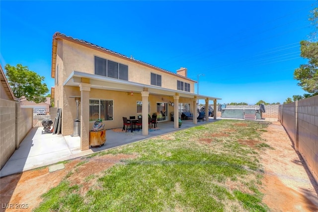 8914 Termoli St, Las Vegas, NV 89123 - rear view of property with stucco siding, a patio area, a fenced backyard, and a chimney