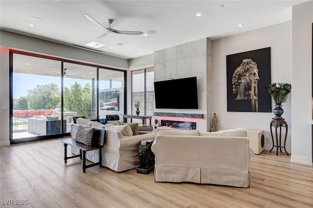 527 Serenity Point Dr, Henderson, NV 89012 - living room with a ceiling fan, light wood-style floors, plenty of natural light, and recessed lighting