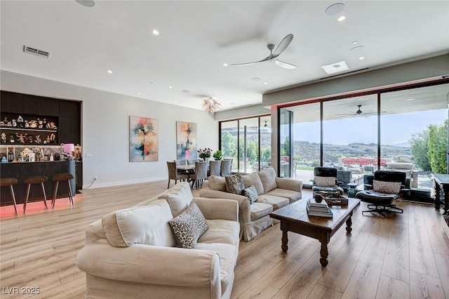 527 Serenity Point Dr, Henderson, NV 89012 - living room with ceiling fan, light wood finished floors, and recessed lighting