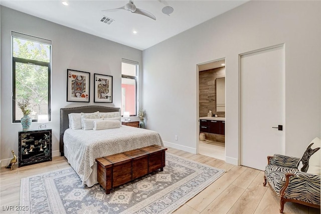 527 Serenity Point Dr, Henderson, NV 89012 - bedroom with light wood finished floors, recessed lighting, connected bathroom, and ceiling fan