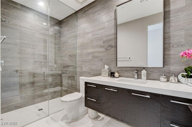 527 Serenity Point Dr, Henderson, NV 89012 - full bath featuring vanity, a stall shower, tile walls, and tile patterned flooring