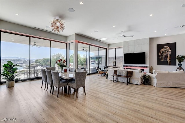 527 Serenity Point Dr, Henderson, NV 89012 - dining space featuring ceiling fan, light wood-style floors, recessed lighting, and a mountain view