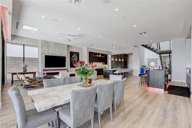527 Serenity Point Dr, Henderson, NV 89012 - dining area featuring light wood finished floors, recessed lighting, and a ceiling fan