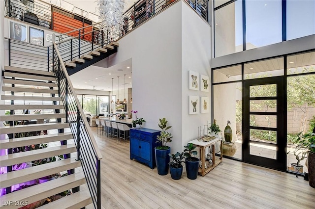 527 Serenity Point Dr, Henderson, NV 89012 - foyer with a high ceiling, stairway, and wood finished floors