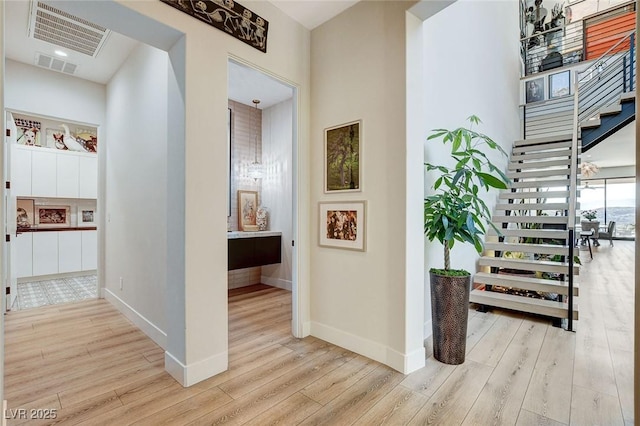 527 Serenity Point Dr, Henderson, NV 89012 - hallway with wood finished floors and stairs