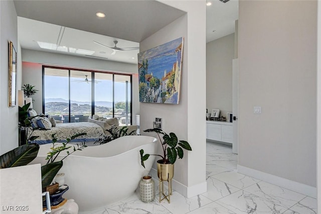 527 Serenity Point Dr, Henderson, NV 89012 - interior space featuring marble finish floors, ceiling fan, recessed lighting, and a mountain view
