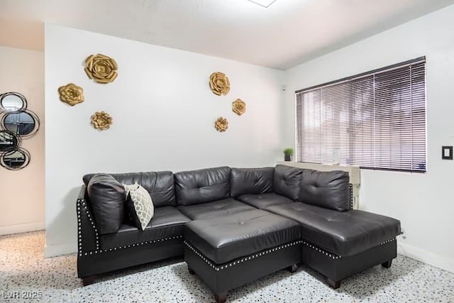 4955 Jeffreys St Unit 605, Las Vegas, NV 89119 - living area with baseboards and speckled floor