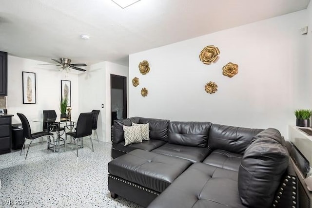 4955 Jeffreys St Unit 605, Las Vegas, NV 89119 - living area featuring dark speckled floor and ceiling fan