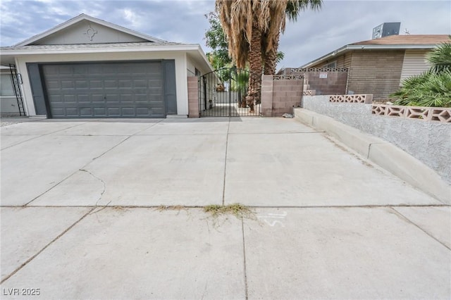 4269 Roanridge Ave, Las Vegas, NV 89120 - view of home's exterior with a gate, driveway, and an attached garage