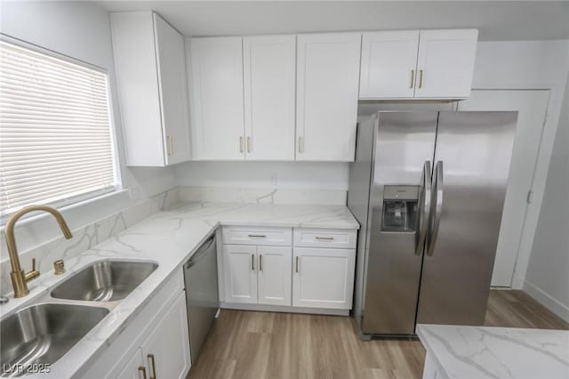 4269 Roanridge Ave, Las Vegas, NV 89120 - kitchen featuring stainless steel appliances, light wood finished floors, white cabinetry, and light stone countertops