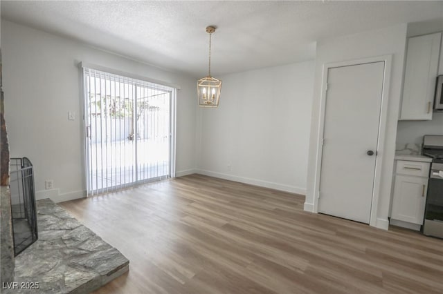 4269 Roanridge Ave, Las Vegas, NV 89120 - unfurnished dining area featuring a chandelier and light wood-style flooring