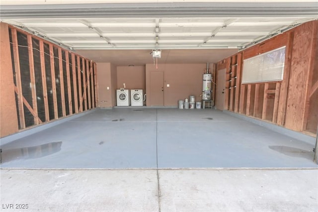 4269 Roanridge Ave, Las Vegas, NV 89120 - garage with washer and clothes dryer, strapped water heater, and a garage door opener
