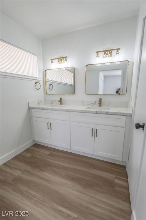4269 Roanridge Ave, Las Vegas, NV 89120 - bathroom with double vanity and wood finished floors