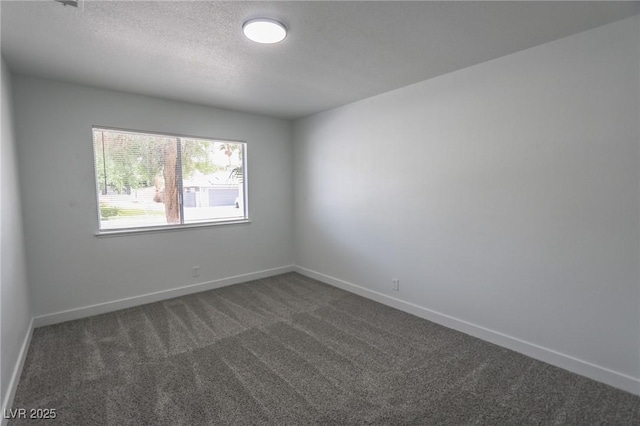 4269 Roanridge Ave, Las Vegas, NV 89120 - spare room featuring dark colored carpet and a textured ceiling