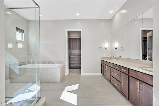 2170 Monte Bianco Pl, Henderson, NV 89044 - bathroom with a bath, double vanity, a stall shower, recessed lighting, and tile patterned floors